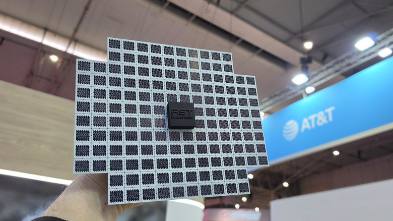 Man holding a satellite mock up