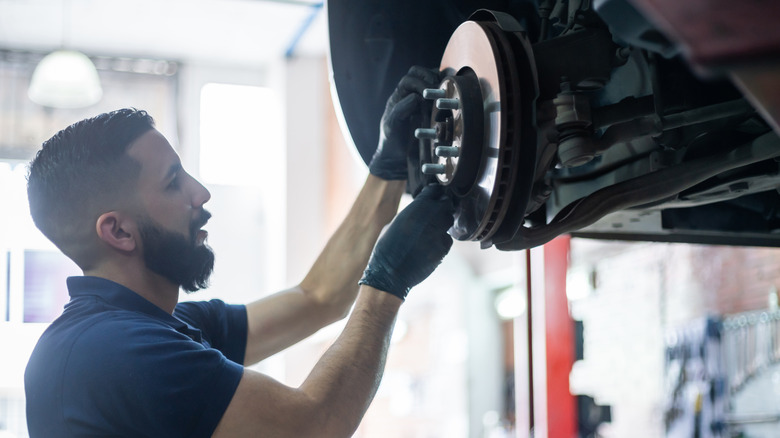 man working on brakes