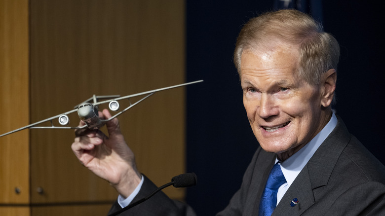 Bill Nelson holding model plane