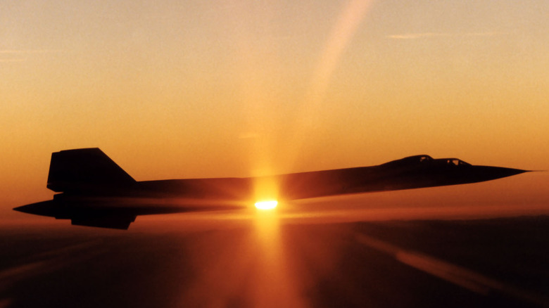 Side view of SR-71 Blackbird flying at sunset.