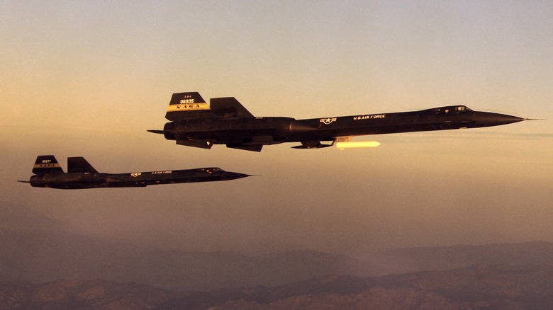 A YF-12A and disguised SR-71 in flight for NASA
