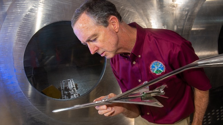 Don Durston near model supersonic airplane