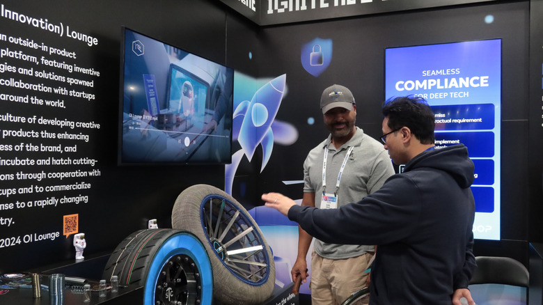 Two people looking at SMA tires