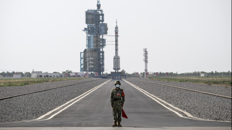 A soldier stands guard as China prepares to launch a mission to its Tiangong Space Station in 2023.