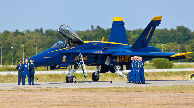 A Blue Angels aircraft on a runway.