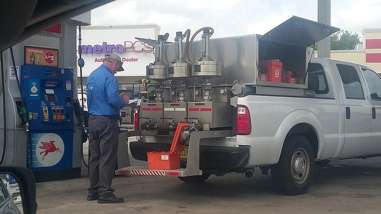 A state inspector visits a Mobil station in Port Charlotte, Florida to check the accuracy of the pumps and the quality of the fuel being sold.