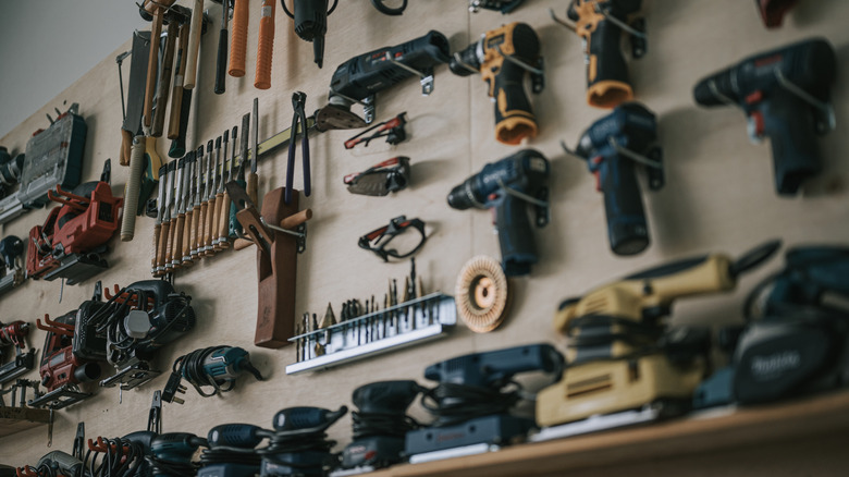 Tools on the wall of a workshop.