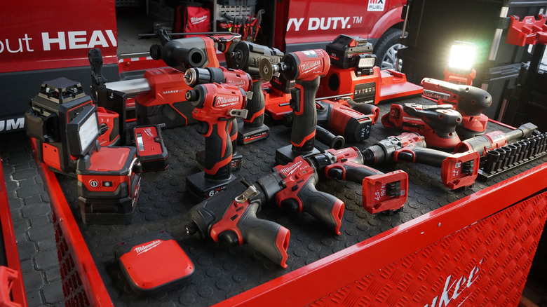 A table full of Milwaukee tools.