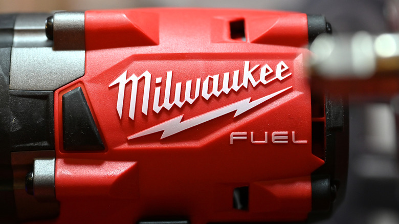 The Milwaukee logo on the side of a power tool.