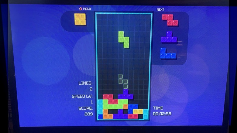 "Tetris Time Warp" gameplay on TV screen