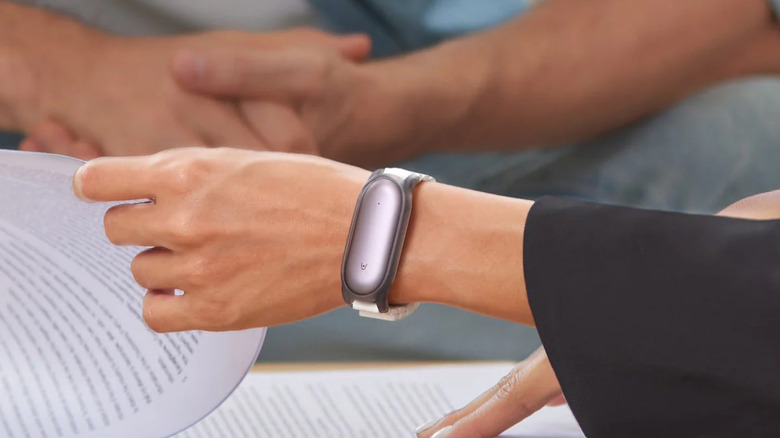 The PLAUD NotePin being worn as a wristband