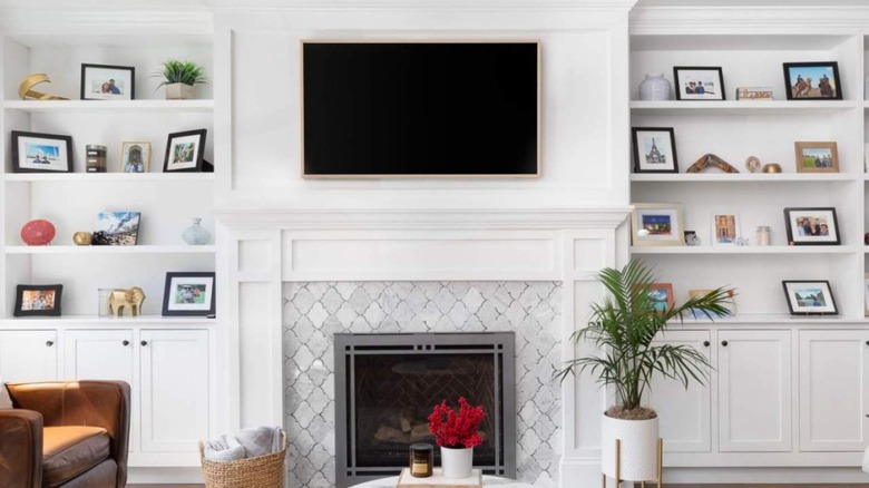 TV mounted above fireplace