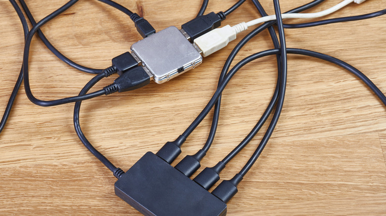 USB hubs connected to each other with many cables and devices