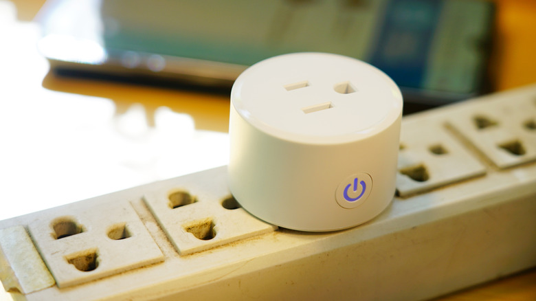 A smart plug plugged into an extension cord
