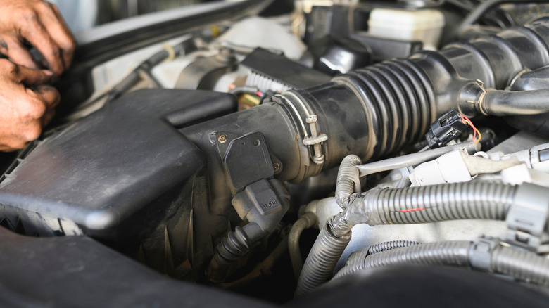 A close up shot of the Mass Air Flow sensors in a car's engine bay.