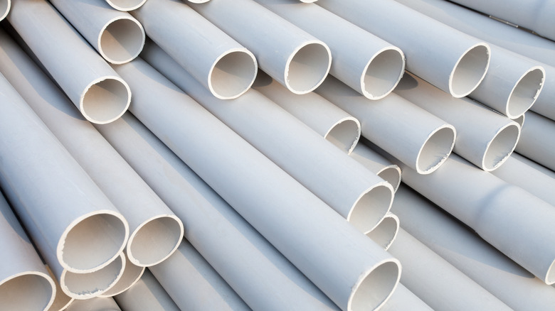 A stack of assorted PVC pipes.