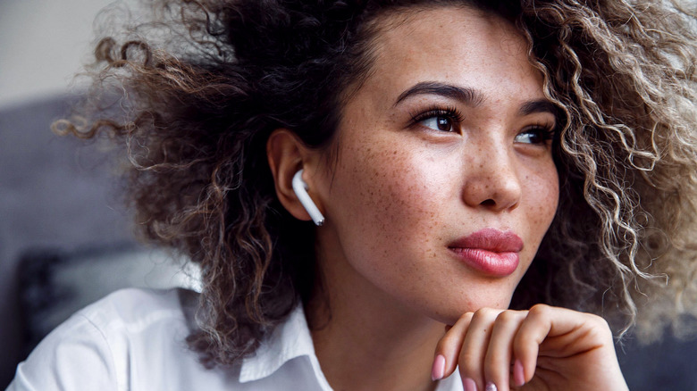 Woman using AirPods