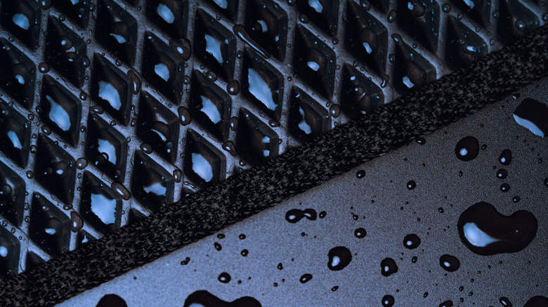 Beads of water on an all-weather floor mat.