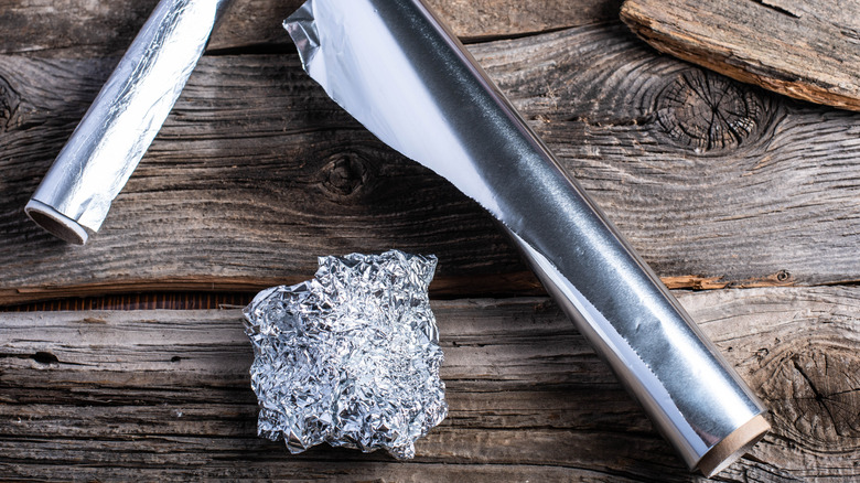 Aluminum foil on a wooden table