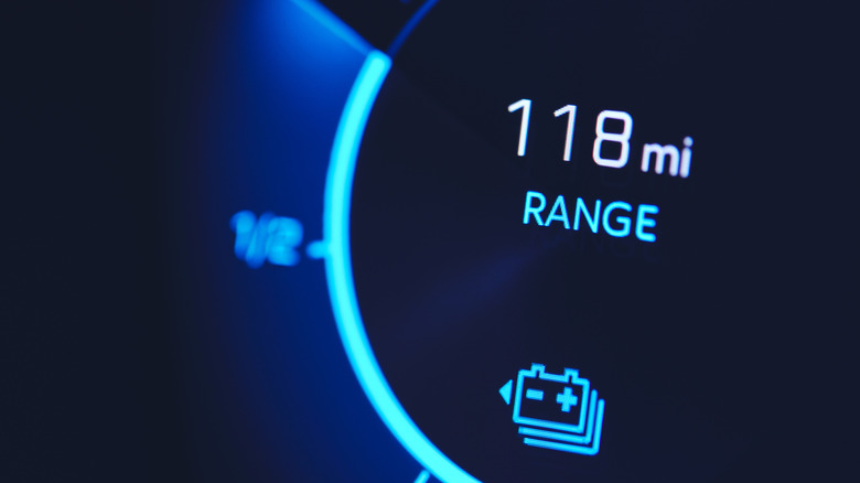 Close-up of range gauge on PHEV car showing 118 miles remaining