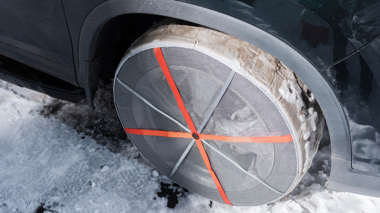 Snow sock on vehicle tire