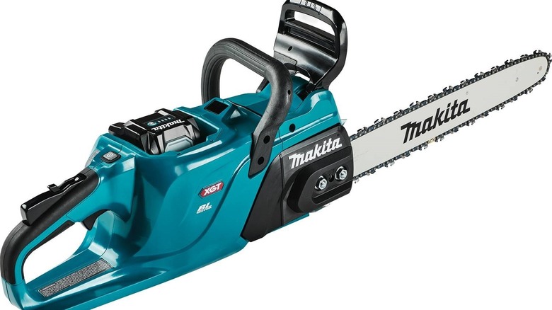Makita GCU11Z rear handle chainsaw with battery on a white background.