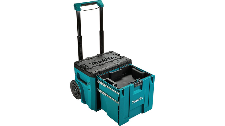 Makita's MakTrak T-90233 tool box with the handle and drawer open on a white background.