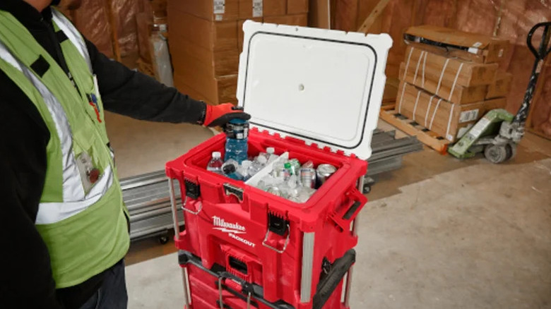 Milwaukee Packout 40-quart XL Cooler being opened and used