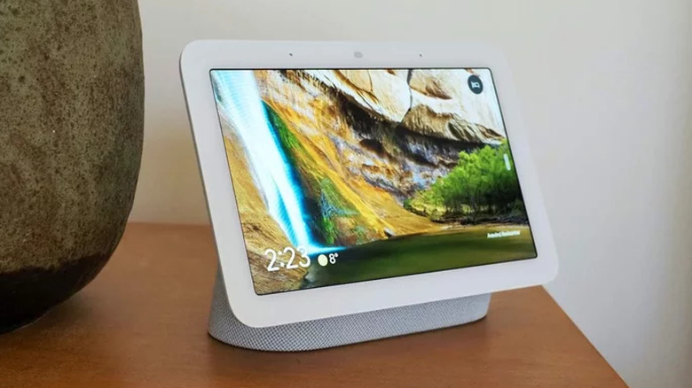 Google Nest Hub 2 on bedside table next to a vase