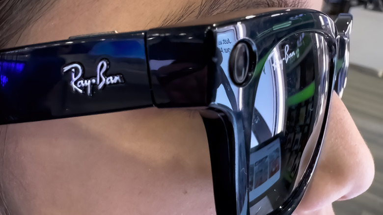 Close up side view of smart glasses wearer.