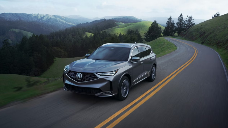 A shot of a gray 2026 Acura MDX driving
