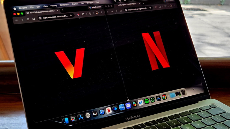 The Netflix logo beside the new Verizon logo on a laptop