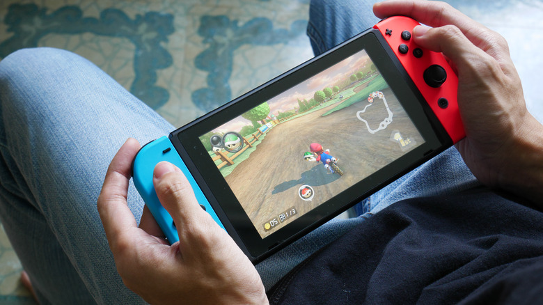 Person gaming on a Nintendo Switch.