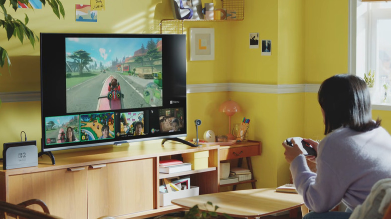 Woman playing Switch 2 with GameChat and camera