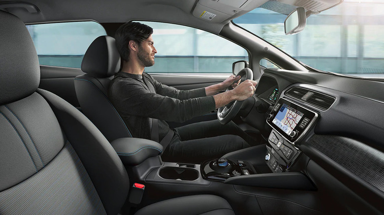 Image of man driving Nissan Leaf