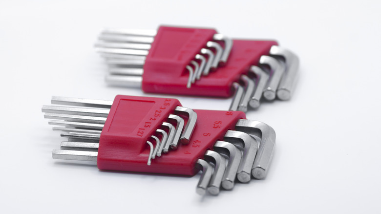 Two Sets Of Allen Wrenches Against A White Background
