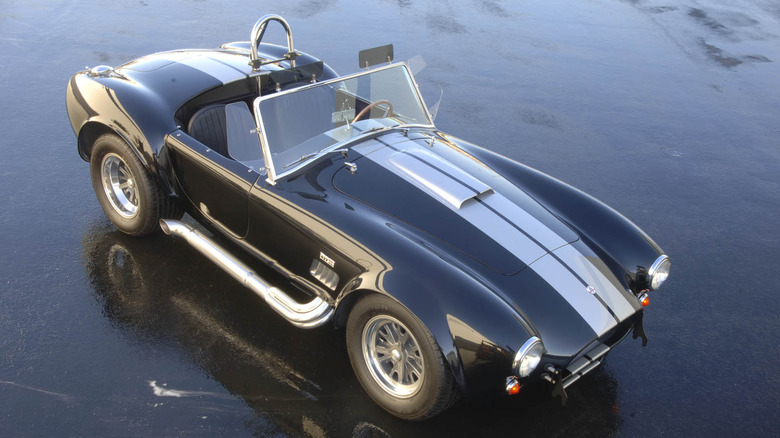 1966 Shelby Cobra 427 S/C in black with white stripes, aerial view, front-right three-quarter