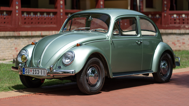 A classic turquoise pearl green metallic Volkswagen Beetle