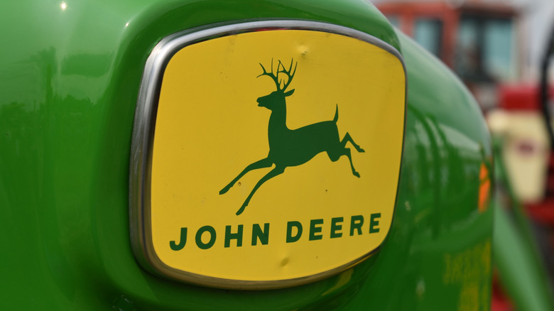 The John Deere logo on a tractor.