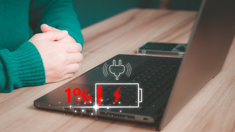 Laptop with a symbol representing battery life.