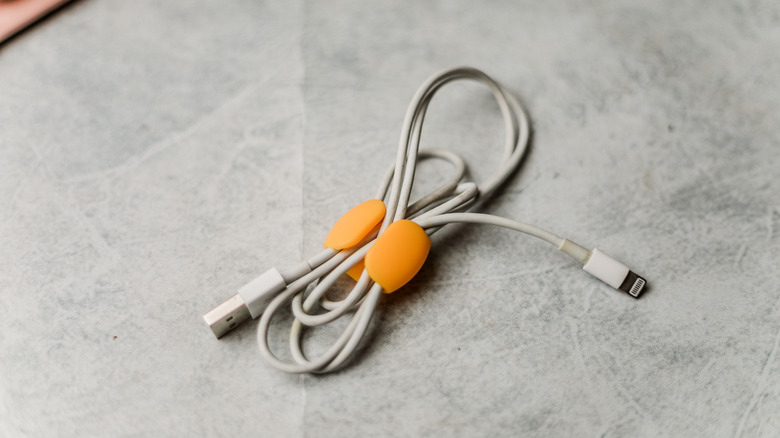 a lightning cable wrapped in a cuff