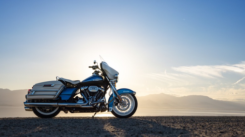 A Harley-Davidson 2021 Electra Glide Revival parked in dirt at sunset
