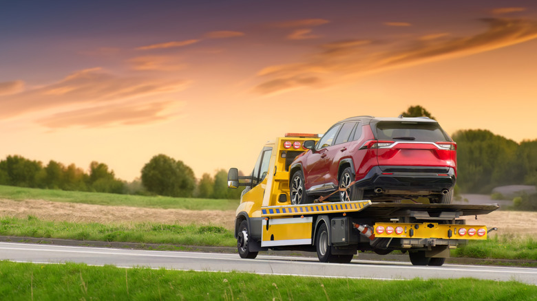 Tow truck hauling vehicle