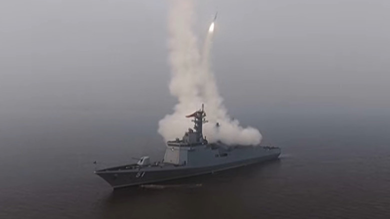 North Korean destroyer the Choe Hyon test firing missiles at sea