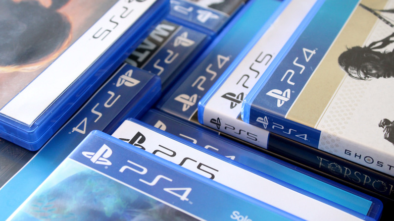 Stacks of PlayStation 5 games in their cases.