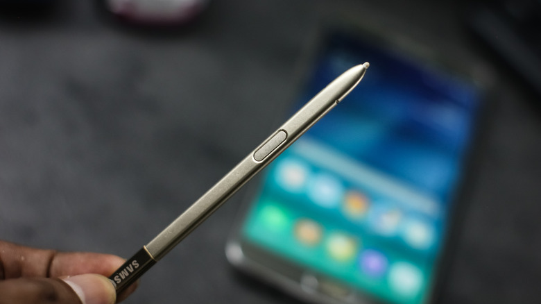 Samsung S Pen held in fingers.