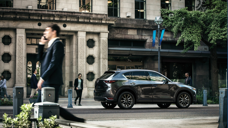 2019 Mazda CX-5 parked in an urban setting in front of a building