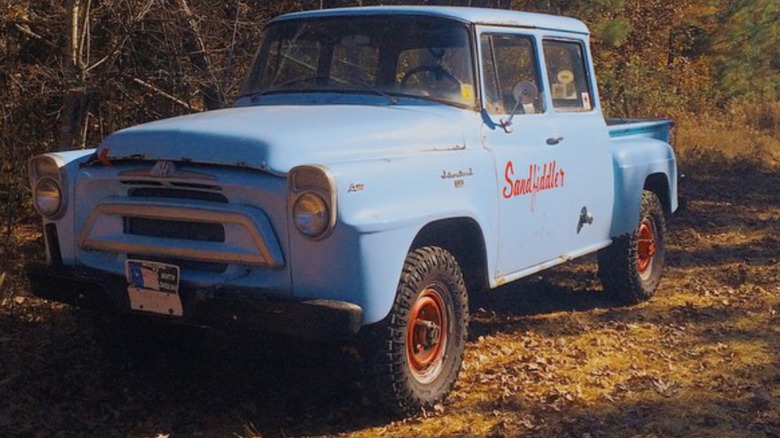 A 1958 International Harvester Travelette three-door crew-cab 4x4 pickup truck.