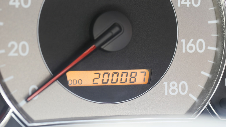 A speedometer showing more than 200,000 miles