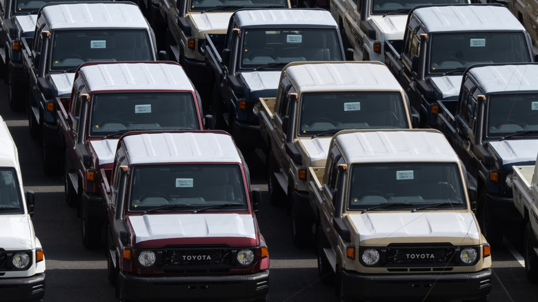 Rows of new Toyota Land Cruisers awaiting shipment